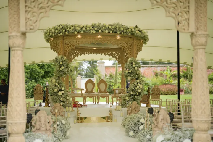 Floral ceremony canopy and white aisle